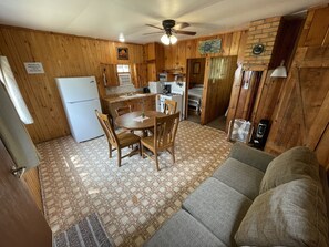 Cabin 3's combined kitchen/dining/living area