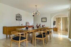 Enjoy a  delicious meal with this classic wooden 8 seater dining table.
