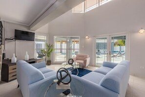 You are greeted by a charming living room area. The pastel-colored sofa will brighten and liven up your day.