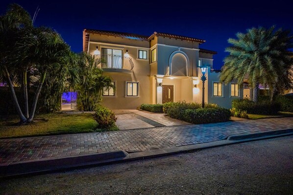 The mesmerizing view of the villa at night time.