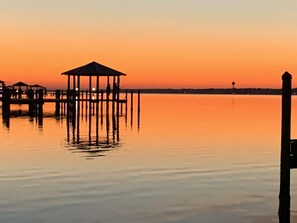Watch the sunset at the end of a perfect day on our private pier, just a short walk from the home