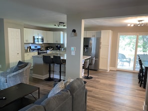 Completely renovated first floor great room with kitchen, dining and family area