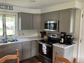 Newly renovated kitchen with all new cabinets, stainless steel appliances . 