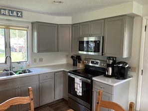 Newly renovated kitchen with all new cabinets, stainless steel appliances . 