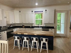 Kitchen with door to back patio.