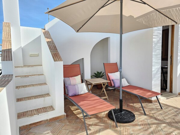 Terrace with sunbeds