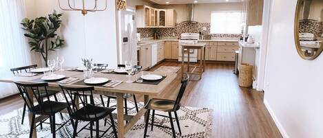 Open concept with a great dining table that can comfortably seat 6+