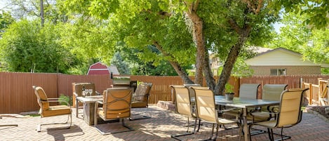 Outdoor patio with tons of outdoor seating, firepit and Grill. 
