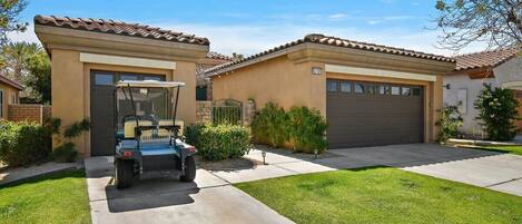 Front of house with Golf Cart