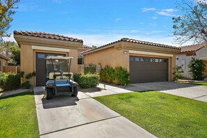 Front of house with Golf Cart available upon request