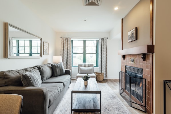Living area has a gas fireplace, a LCD Tv (Now above the FP) and a sofa bed