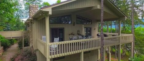 Massive wrap-around deck, partially covered. Grill and patio table.