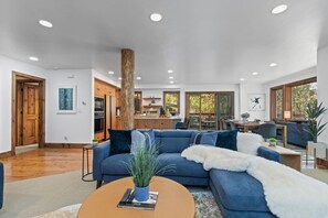 Unwind in style! This large, modern living room with a TV and gas fireplace is designed for relaxation and entertainment