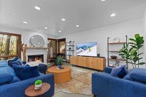 Great Room with natural light, gas fireplace, television and plenty of space for memories to be made