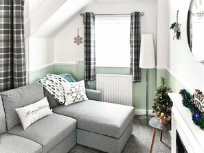 Living room decorated for Christmas | Bramble Cottage, Brampton