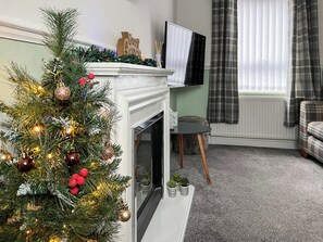 Living room decorated for Christmas | Bramble Cottage, Brampton