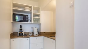 Very handy kitchenette with a dishwasher, microwave, mini fridge, coffee machine, stove and cooking utensils. #kitchen #cooking