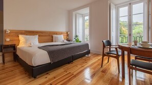 Gorgeous main area with a king size bed, a balcony and an AC unit #AC #spacious