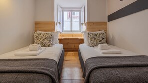 Second bedroom with 2 single beds. Comfortable mattresses and soft linen included! #cozy