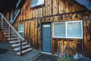 Cabin 7 front door. The lockbox is under the sconce.
