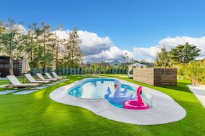 Plenty of lounging options and a sparkling pool await!