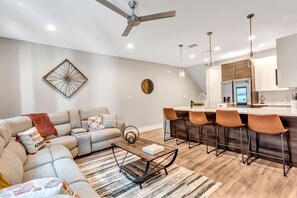 2nd Floor - Living room area with kitchen view.