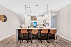 2nd Floor - Living room area with kitchen view.