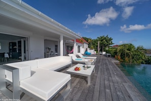 Terrace & Pool: Large outdoor terrace with sunny and shaded areas as well as deckchairs, a relaxatio