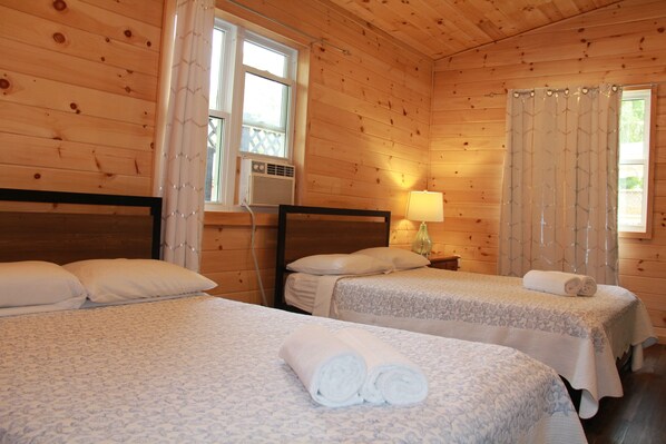 Room with two double beds.