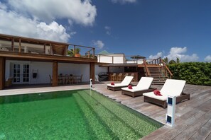 Terrace & Pool: A large terrace surrounds the oversized swimming pool as well as sun beds and deckch