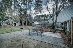 The back of the house with a sitting area.