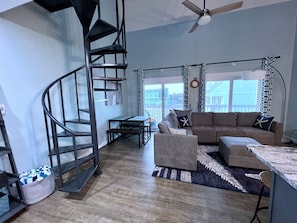 Staircase takes you to upstairs loft. 