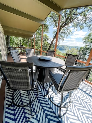 Fire pit table with lake view from upper deck