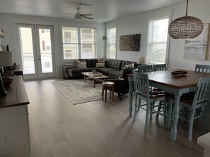 Large living room and dining room area has beautiful view of the Gulf of Mexico.