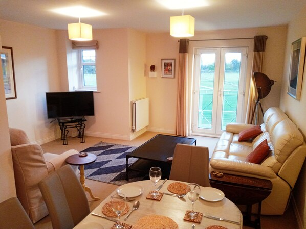 The spacious sitting dining area on the first floor next to the kitchen