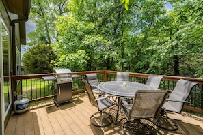 Back Porch With Gas Grill And Outdoor Dining Set