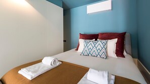 Bedroom with high-quality mattress and AC unit