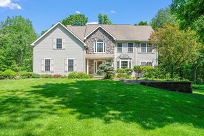 Front of the house with spacious front yard