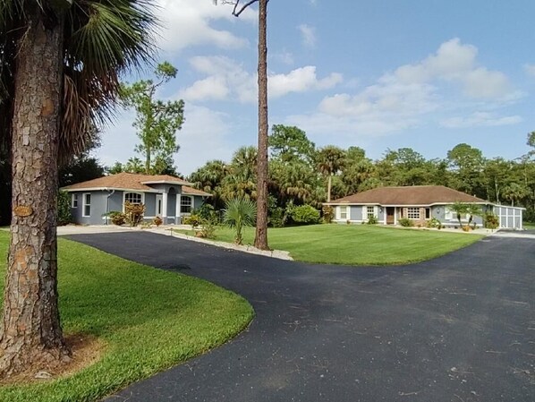 Guest house is to the left / the main house is straight ahead.  