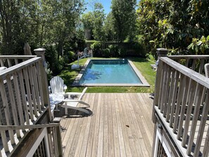 Two Tiered deck overlooking heated salt water pool