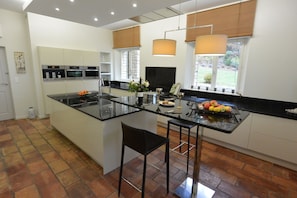 large kitchen equipped with Miele appliances
