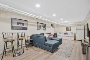 Finished basement. Equipped with full washer and dryer and convertible king bed