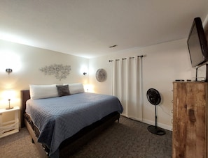 Spacious Master Bedroom with new furniture and large mounted TV!