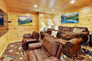 Private movie theater room with smart TV and DVD player and a collection of DVDs