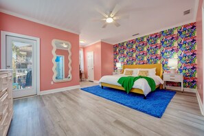 Upstairs master bedroom. King size bed. Large spacious room with private closet, bathroom, and entrance to balcony.