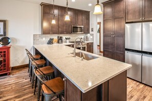 Fully appointed kitchen with additional bar seating