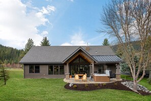 Relax in peace and quiet on the back porch with private hot tub