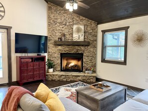 Living room w 58” Smart TV and fireplace 