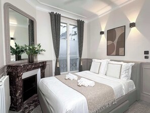 The bedroom features a Queen-size bed, ceiling fan, and ample storage for belongings.