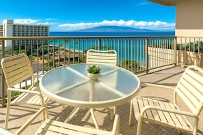 Savor panoramic ocean views and soft island breezes from this serene lanai with elegant seating WH2-1169